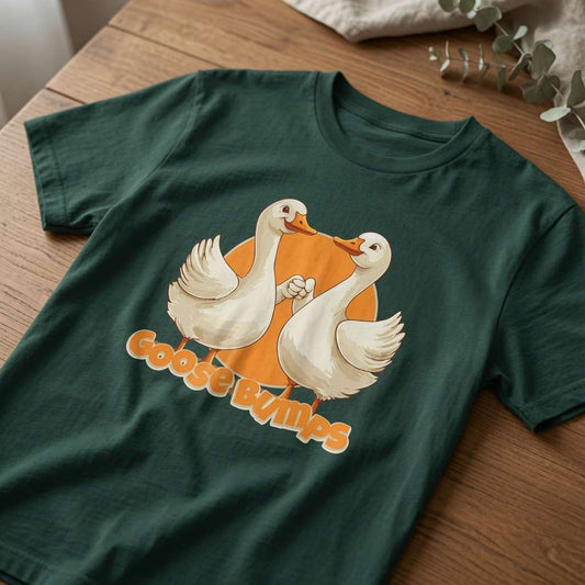 Glazed green Goose Bumps t-shirt on wood featuring two geese fist-bumping, funny mens witty goose graphic