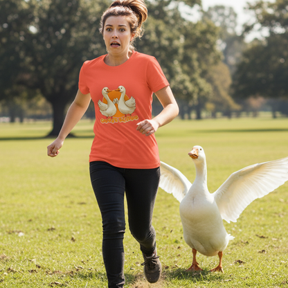 Woman running with a goose on a grassy field