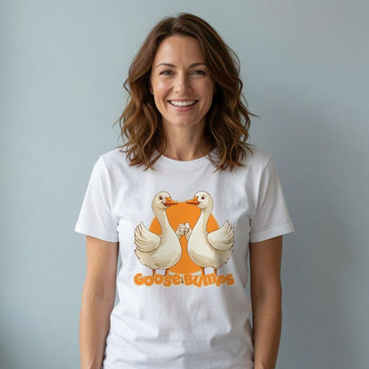 Woman smiling in white Goose Bumps t-shirt featuring two geese fist-bumping, humorous ladies goose pun graphic