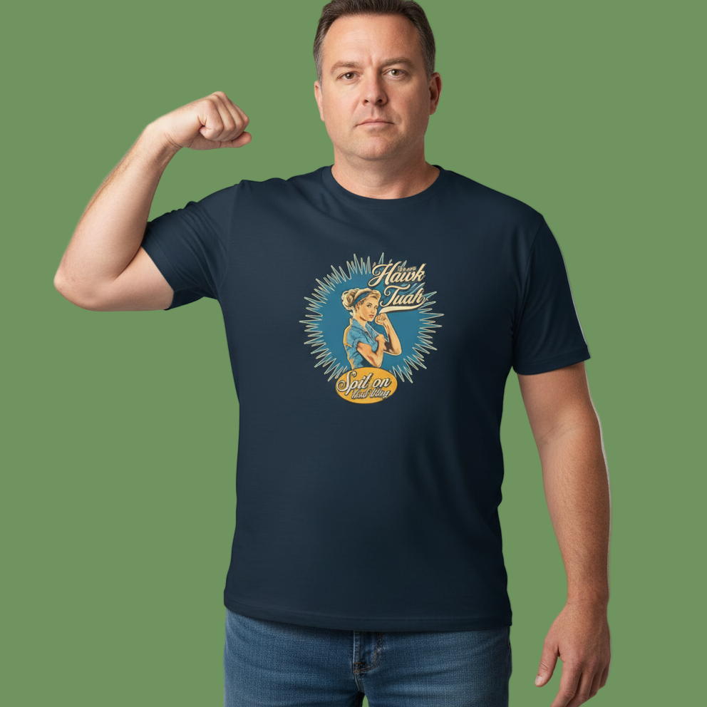 Man wearing a navy blue t-shirt with a graphic design on a green background