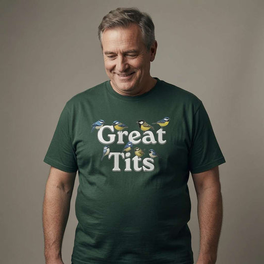 Grey-haired man smiling looking down in glazed green Great Tits t-shirt, funny witty offensive bird pun graphic