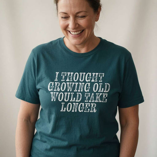 Woman smiling looking down in stargazer I Thought Growing Old Would Take Longer tee, humorous funny ladies slogan