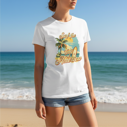 Person wearing a white t-shirt with a tropical graphic design on a beach