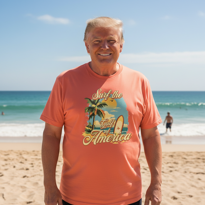 Man wearing a 'Surf the Land of America' t-shirt on a beach