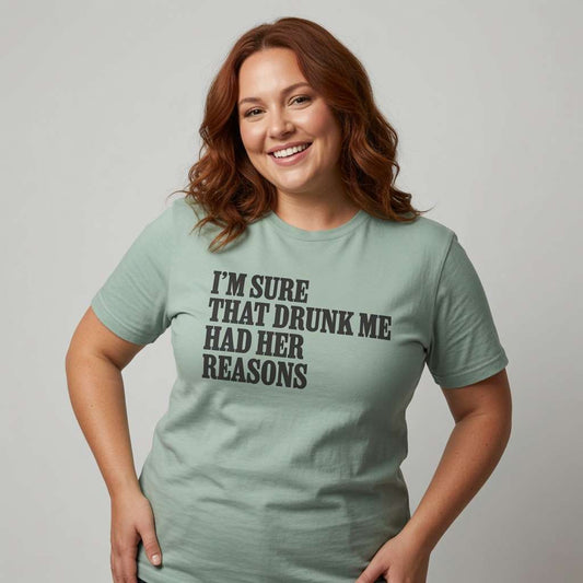 Red-haired woman smiling with hand on hip in aloe I’m Sure That Drunk Me Had Her Reasons tee, funny witty slogan