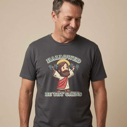 Man smiling looking down in black Hallowed Be Thy Gains tee with Jesus gym design, witty mens Jesus graphic