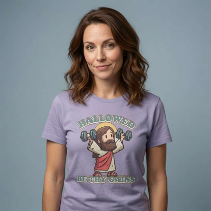 Woman with slight smile in lavender Hallowed Be Thy Gains tee, funny rude fitness graphic