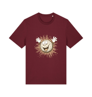 burgundy graphic t-shirt featuring a cartoon golf ball with a smiley face