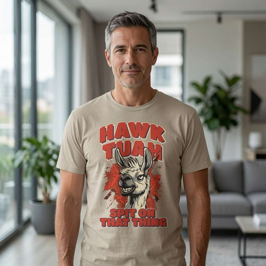 Grey-haired man indoors in beige Hawk Tuah Spit on That Thing tee with llama design, mens funny witty viral meme animal