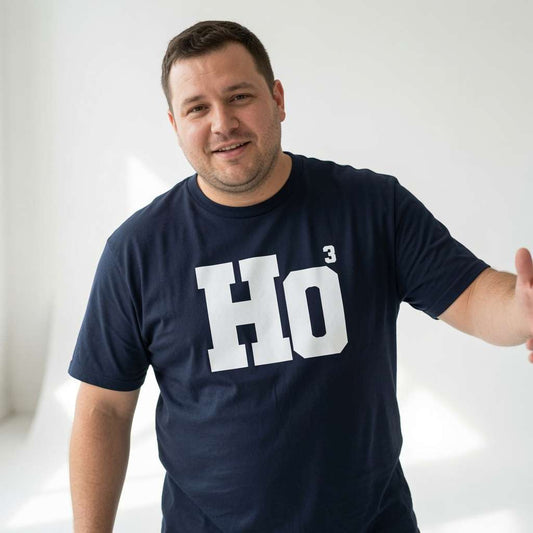 Man gesturing in navy HO³ t-shirt, fun mens witty cheeky xmas slogan