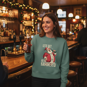 green christmas sweater with the graphic of santa drinking a beer and the slogan 'lets get ho ho hammered'