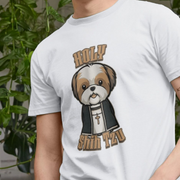 White funny dog t-shirt with a cartoon Shih Tzu illustration and text, worn by a person with plants in the background.