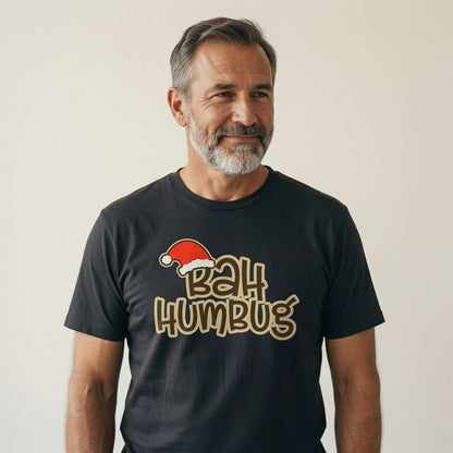 Grey-bearded man smiling in black Bah Humbug tee, fun mens cheeky christmas slogan