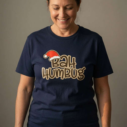 Woman looking down smiling in navy Bah Humbug tee, fun cheeky ladies xmas slogan