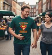 Man wearing a green t-shirt with a Superman logo and text, walking with a woman on a street.
