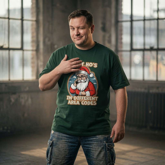 Man winking with hand on chest in green I Got Ho’s in Different Area Codes t-shirt, witty funny mens christmas pun graphic