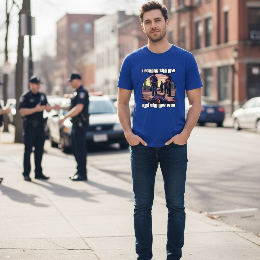 Man wearing a blue t-shirt with a graphic design on a city street.