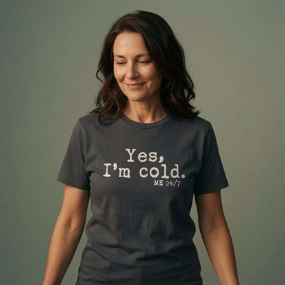 Woman looking down smiling in ink grey Yes, I’m Cold. ME 24/7 tee, ladies fun cheeky slogan
