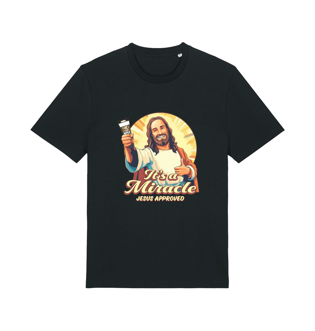 black funny jesus t-shirt with the graphic of jesus holding a tube of no more nails and the slogan 'it's a miracle jesus approved'