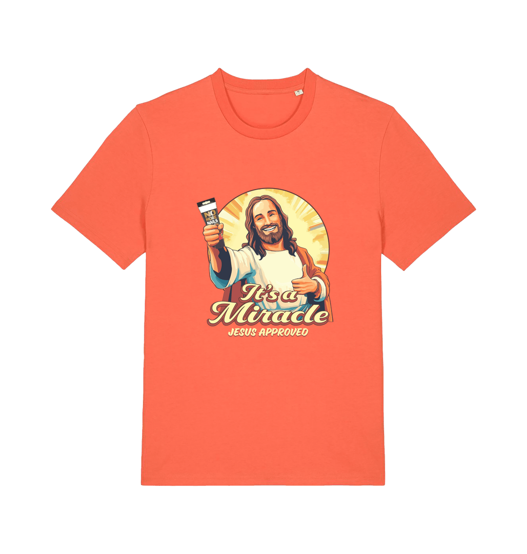 orange funny jesus t-shirt with the graphic of jesus holding a tube of no more nails and the slogan 'it's a miracle jesus approved'