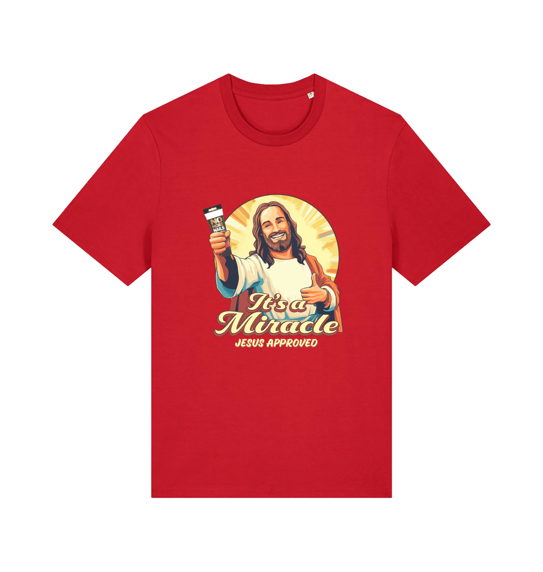 red funny jesus t-shirt with the graphic of jesus holding a tube of no more nails and the slogan 'it's a miracle jesus approved'