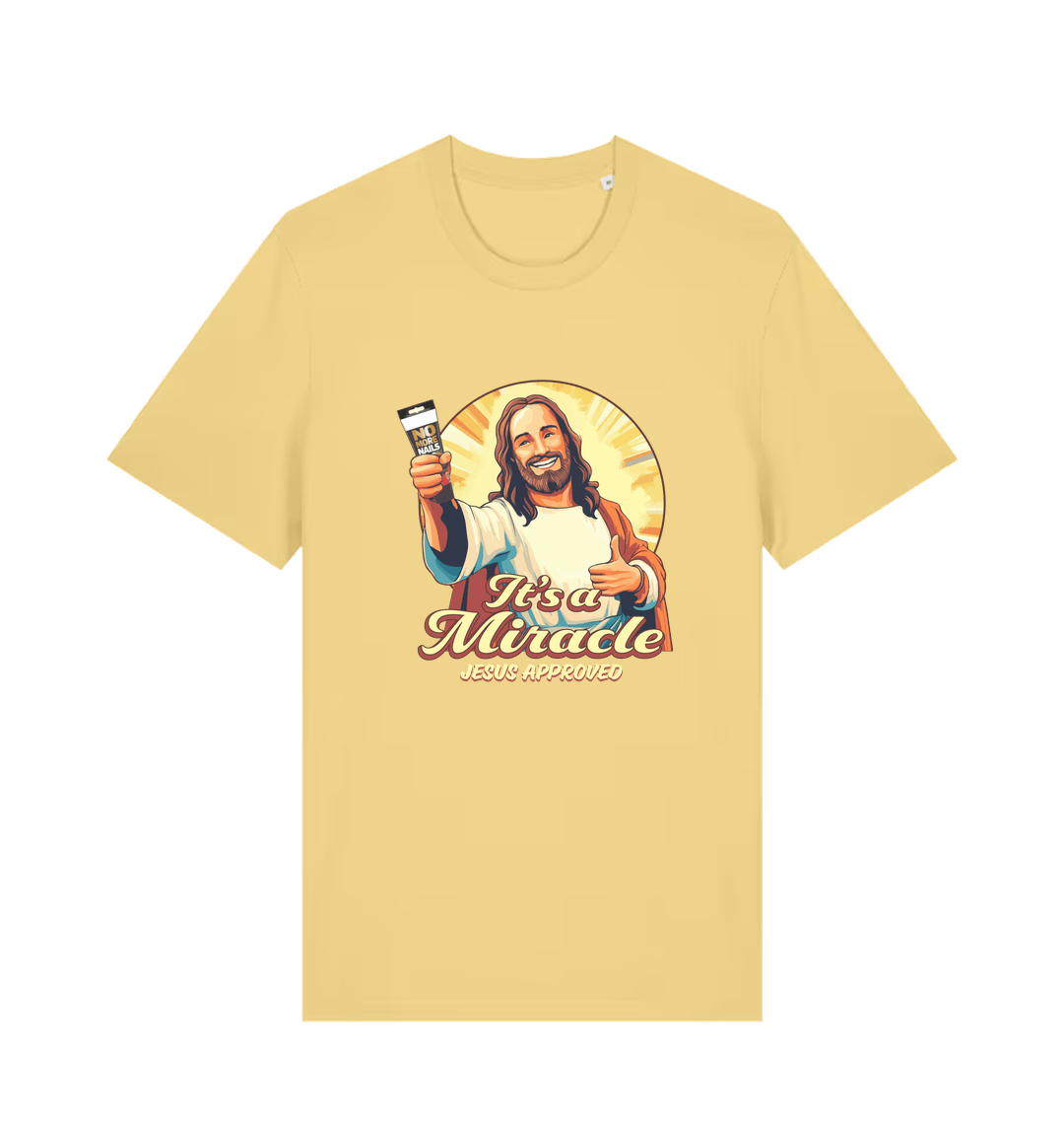 yellow funny jesus t-shirt with the graphic of jesus holding a tube of no more nails and the slogan 'it's a miracle jesus approved'