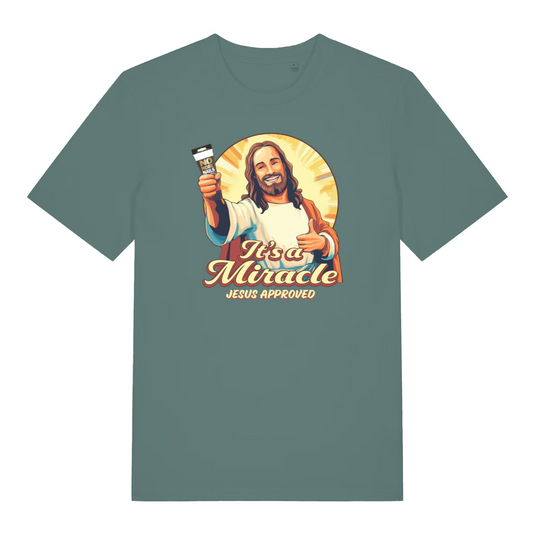 green funny jesus t-shirt with the graphic of jesus holding a tube of no more nails and the slogan 'it's a miracle jesus approved'