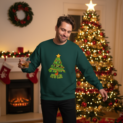 Man wearing a green sweater with a Christmas tree design, holding a glass, in a festive room with a tree and fireplace.