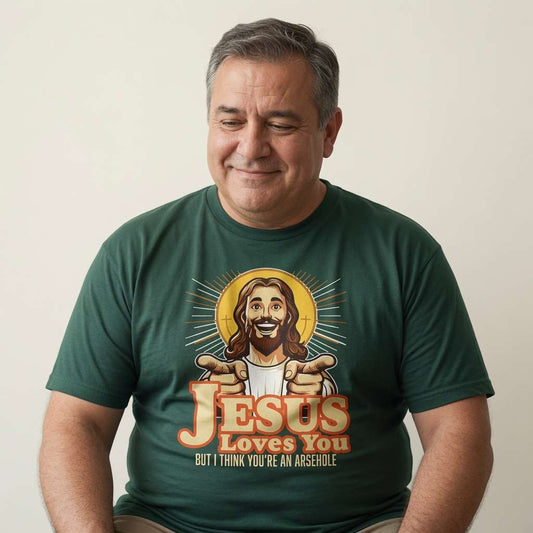 Man looking down smiling in green Jesus Loves You But I Think You’re an Arsehole t-shirt, funny mens rude offensive graphic