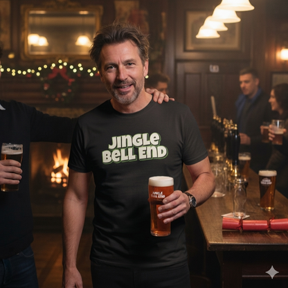 Man wearing a 'Jingle Bell End' shirt holding a beer in a pub setting