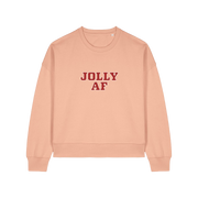 peach xmas sweater with the slogan 'jolly af'