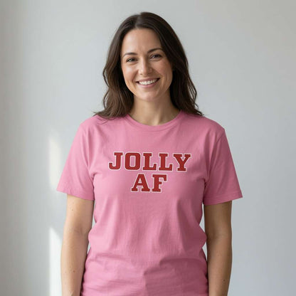 Woman smiling at camera in pink Jolly AF t-shirt, cheeky ladies christmas pub
