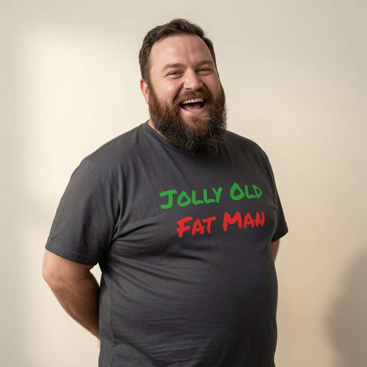 Bearded man laughing looking to the side in black Jolly Old Fat Man tee, fun humorous mens christmas day pub