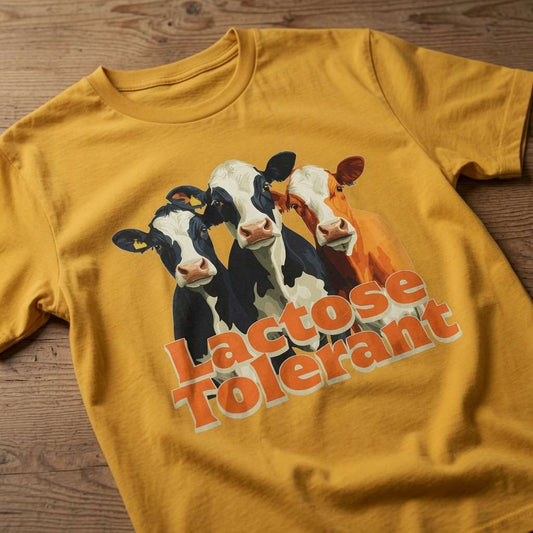 Yellow Lactose Tolerant t-shirt on wood featuring three cows graphic, fun mens witty cow lactose graphic
