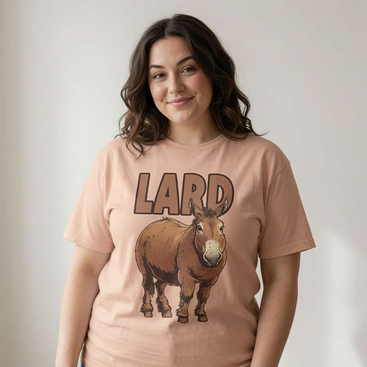 Woman with slight smile in peach Lard Ass t-shirt featuring chubby donkey graphic, fun ladies cheeky ass donkey graphic