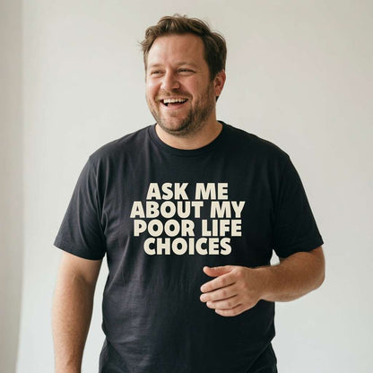 Man laughing gesturing in black Ask Me About My Poor Life Choices tee, fun mens relatable statement