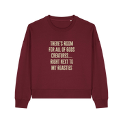burgundy christmas sweater with the slogan 'there's room for all of gods creatures next to my roasties'