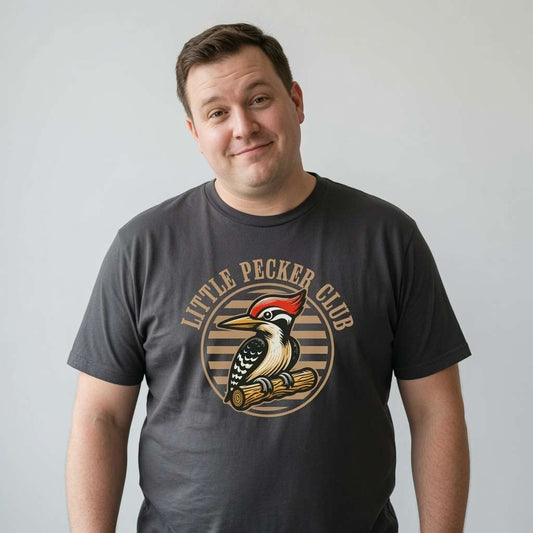 Man with slight smile looking to the side in black Little Pecker Club tee with woodpecker design, funny mens woodpecker pun graphic