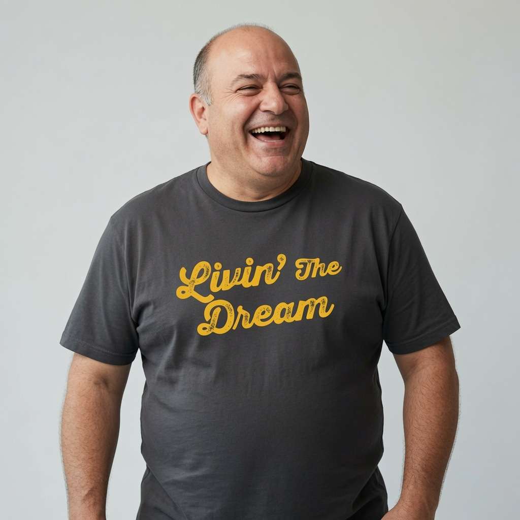 Balding man laughing in black Livin’ The Dream tee, funny mens relatable slogan