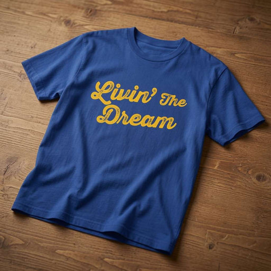 Blue Livin’ The Dream t-shirt on wood, mens witty relatable sarcastic slogan
