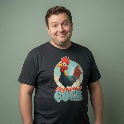 Man with slight smile looking to the side in black Magnificent Cock tee with rooster design, funny mens cockerel pun graphic
