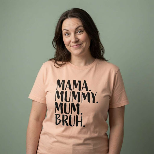 Woman with raised eyebrows slight smile in peach Mama Mummy Mum Bruh t-shirt, ladies relatable mothers day gift