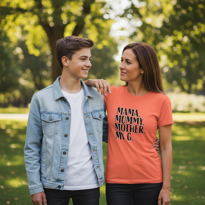 Woman wearing an orange t-shirt with text standing outdoors with a young boy.
