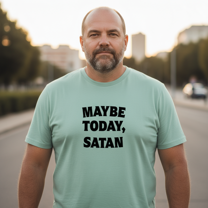 Man wearing a light green t-shirt with 'MAYBE TODAY, SATAN' text outdoors.