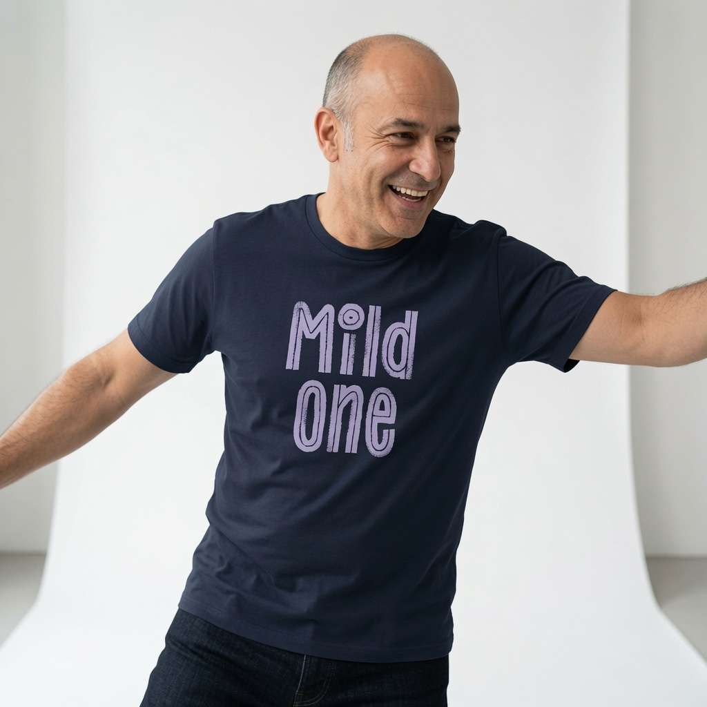 Bald man laughing with arms out in navy Mild One tee, mens fun witty matching slogan