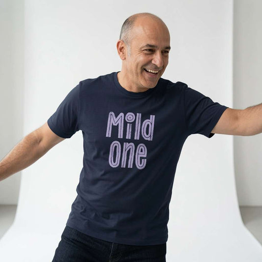Bald man laughing with arms out in navy Mild One tee, mens fun witty matching slogan