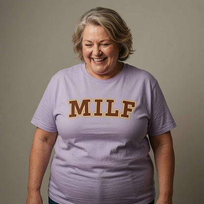 Older woman laughing in lavender MILF tee, witty cheeky mum slogan gift
