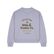 lavender xmas sweater with the slogan 'north pole milk and cookie co'