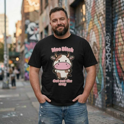 Bearded man smiling with hands in pockets in black Moo Bitch Get Out the Way tee, funny mens cheeky kawaii cow pun graphic