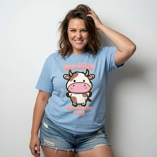 Woman smiling with hand in hair in sky blue Moo Bitch Get Out the Way t-shirt featuring cartoon cow, ladies fun kawaii cow graphic
